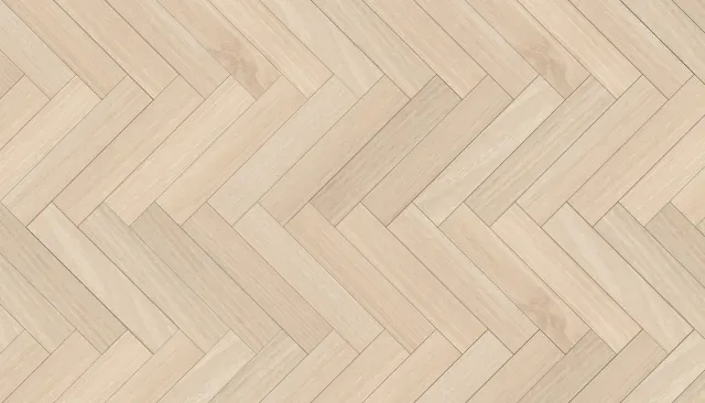 Close-up of light herringbone hardwood flooring.